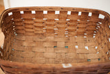 Dark patina on woven splint oak slats inside the antique large basket.