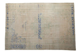 Distressed Oushak carpet with cream field, faded floral medallion, and cobalt blue abrashes, 8'2