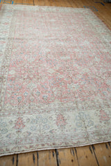 Distressed pile with sprawling floral vine pattern in dusty blush, ivory, and slate blue.