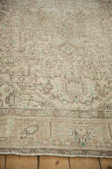 Time-softened tones on distressed vintage Tabriz carpet with pale coffee brown motifs.