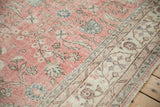 Bubblegum pink floral field with wear meeting an ivory meandering vine border.