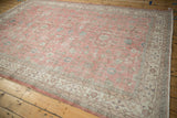 Distressed Turkish Sparta carpet detail with bubblegum pink field, worn floral vines, and ivory border.