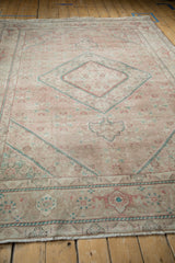 Textured vintage Tabriz carpet with muted beige, dusty teal, raspberry Herati design.