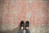Distressed blush pink Sparta rug with worn pile, visible foundation, and subtle vinery.