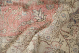 Distressed vintage Sparta rug showing worn pile and foundation in faded blush, sand vinery.