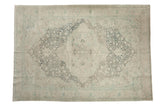 Distressed vintage Kayseri carpet with a starburst medallion design in soft slate blue and ivory tones.