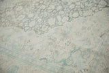 Low-pile texture of a vintage Kayseri rug with soft slate blue and ivory floral patterns.