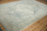 Angled view of the distressed Kayseri carpet, showing its soft patina and textured, low-pile wear.