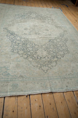 High angle view of a distressed Kayseri rug showing its soft floral design and texture.