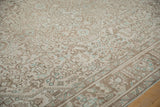 Distressed vintage Tabriz carpet showing even wear, geometric pattern, and powder blue hues.