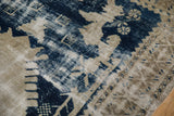 Worn cobalt blue patterns, distressed texture, and exposed foundation on this vintage Oushak rug.