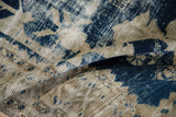 Distressed vintage Oushak rug showing exposed foundation, cobalt blue, and antique ivory.