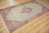 Repeating botehs and raspberry red border of vintage Hamadan rug, showing even wear.