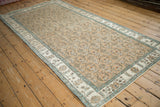 Detail of the machine-bound edge and abrashed floral border on a vintage Sparta rug.