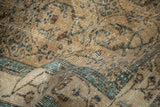 Even wear across the knot heads reveals the faint foundation of this distressed Sparta rug.