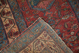 The fine, hand-knotted foundation visible on the back of a folded vintage Malayer rug corner.