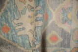 Soft, even wool pile showing the hand-knotted texture of a distressed Oushak rug.