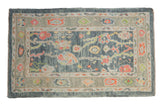 Distressed Oushak rug runner with soft blue field, colorful palmettes and vines.