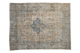 Distressed vintage Turkish Sparta carpet, pale ochre field, sapphire blue medallion, floral palmettes.