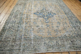 Distressed Turkish Sparta carpet border, showing worn pale field and faded blue designs.