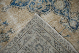 Distressed pile texture and exposed foundation of a vintage Turkish Sparta rug, revealing its fringe.