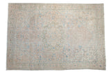 Vintage distressed Sparta carpet with a starburst medallion and floral field in blush, blue, and sage.