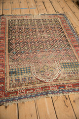 Antique Caucasian rug detail: prayer niche, checkered pattern, sapphire blue and sand.