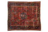 Vintage Lilihan square carpet: serrated medallion, floral field, cherry red, navy, aged patina.