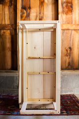 Underside view of the white maple sidecar's sturdy frame and triple slat bottom.
