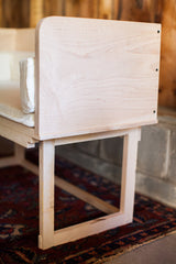 Clean lines and sturdy joinery of the Little Mod Sidecar's white maple frame and back panel.