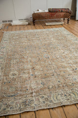 Distressed vintage Sparta rug corner, revealing foundation with faded floral blossoms in neutral tones.