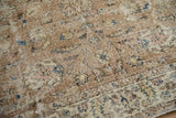 Distressed Sparta rug detail showing worn pile, visible foundation, and muted floral designs.