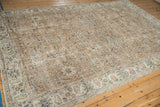 Distressed Turkish Sparta carpet close-up, showing worn floral palmettes and foundation.