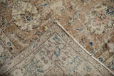 Distressed Sparta carpet pile in coffee brown, beige, blue, revealing foundation; tight back, machine bound.