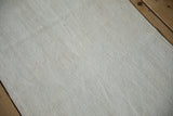 Close-up of vintage hemp kilim texture, plain-weave in ivory, beige, and platinum.