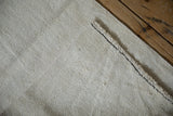Textured plain-weave of the vintage hemp kilim, featuring jet black zigzag stitching and bound edge.