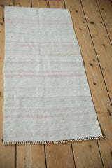 Hemp kilim texture with varied horizontal stripes in platinum, ivory, and soft rose tones.