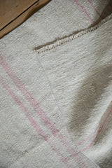 Turkish Hemp Kilim runner's textural hand weave, featuring machine bound edge and rose stripes.