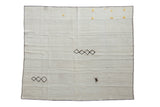 Vintage hemp kilim square carpet in a platinum beige, featuring black stitched diamonds and yellow yarn tufts.