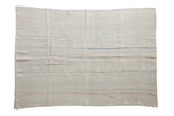 A vintage hemp kilim rug with a beige plain-weave and thin, colorful horizontal accent stripes.