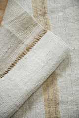 Textured plain-weave of the Turkish hemp kilim with subtle abrashes and machine-bound edge.