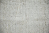 Textured plain weave of the vintage hemp kilim rug in platinum and ivory.