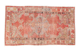 Distressed vintage Oushak rug, shield medallion, faded cherry red, dusty blue, and green, 2'6