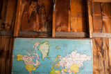 Vintage 1930s Vito Graphic world map, top left with aged blue, yellow, and white canvas.