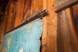Torn blue canvas edge of vintage Vito Graphic pull down world map.