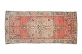 Distressed Oushak runner, abrashed blush field with floral medallion, muted multi-color borders, 2'9