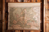 Early 20th century pull-down Europe canvas map, muted greens and browns, rustic texture, 41x34.
