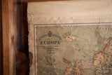 Top-left detail of the antique Europe map, showing Bacon's Excelsior title and creased, faded canvas.