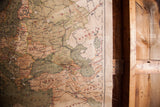 Right edge of a rustic 1919 Europe canvas map with aged texture and wood dowel.