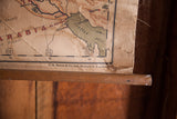 Rustic bottom corner of antique canvas map, Persian Gulf, Bacon Co. text, and wood dowel.